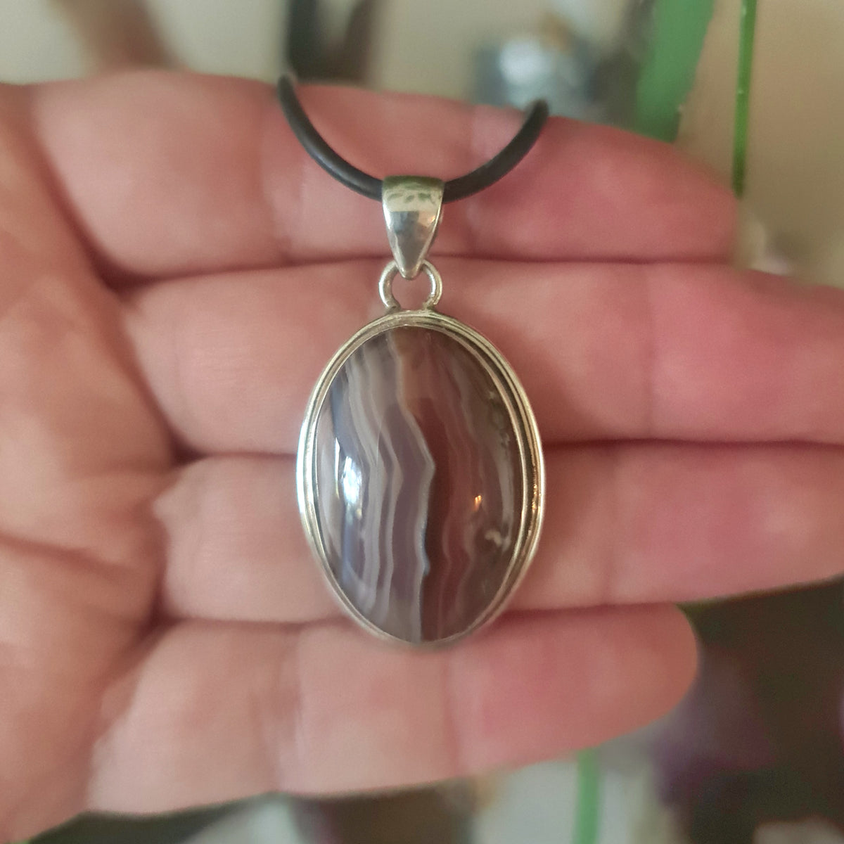 banded brown and white oval pendant set in sterling silver