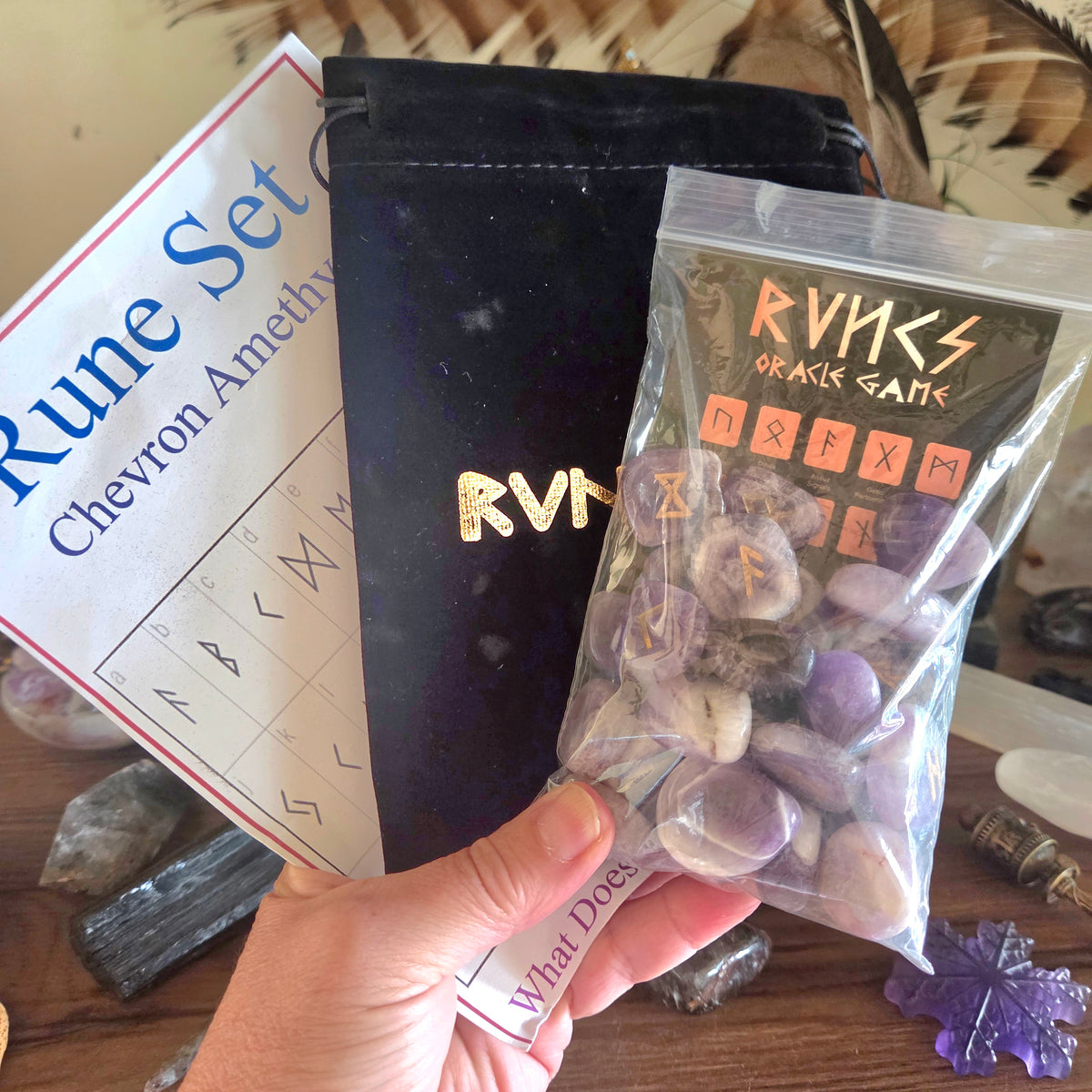 Rune set packaging with stones and instructions on a wooden surface
