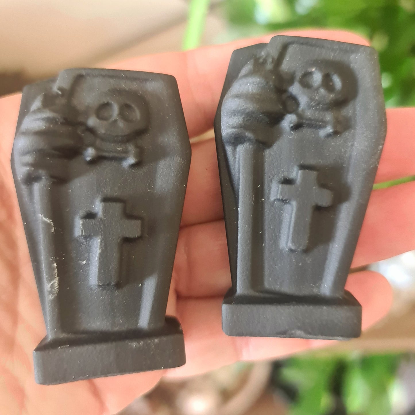 black crystal coffins on a hand