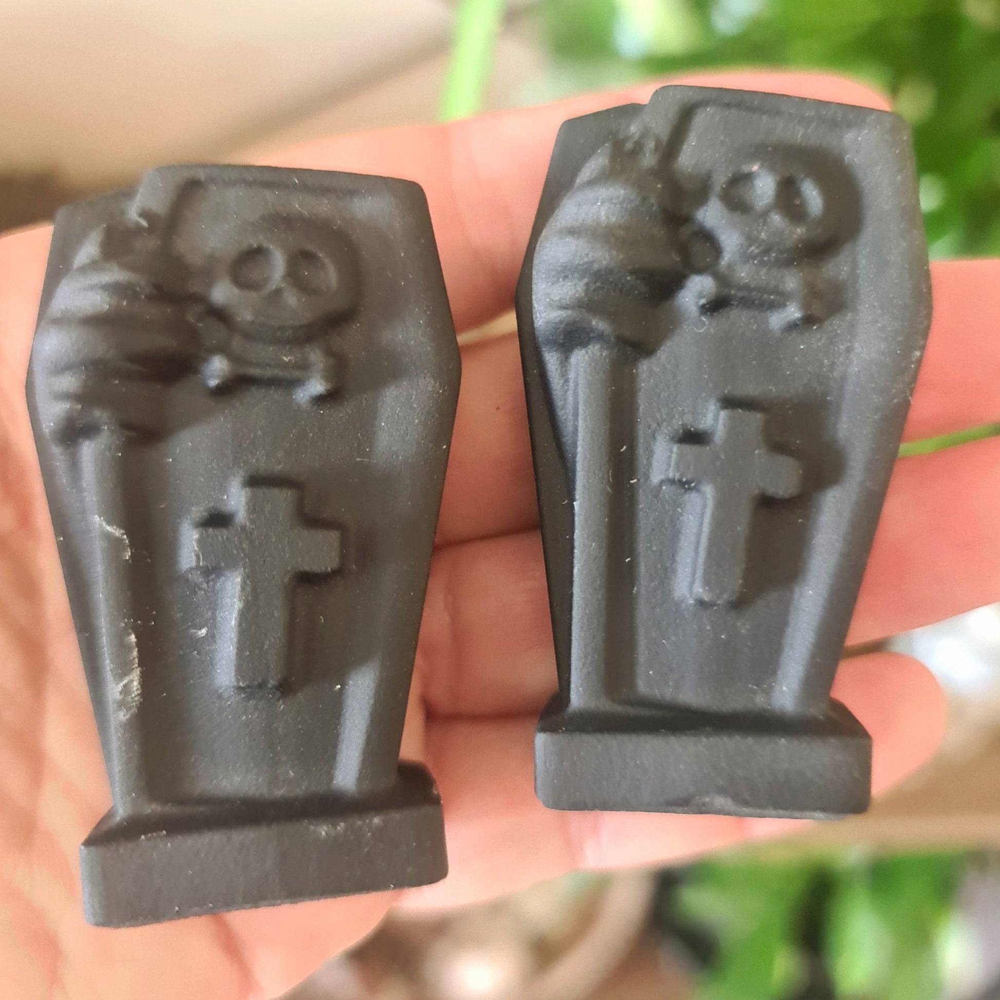 black crystal coffins on a hand