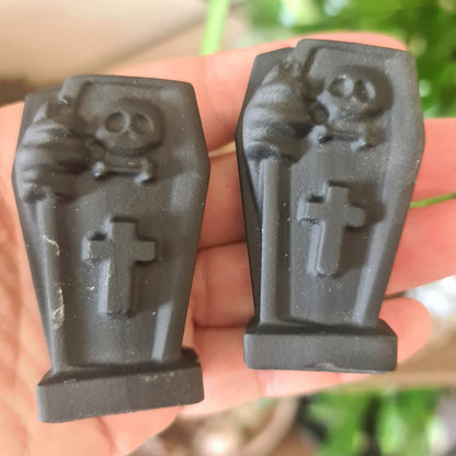 black crystal coffins on a hand
