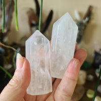clear crystal points held in a hand