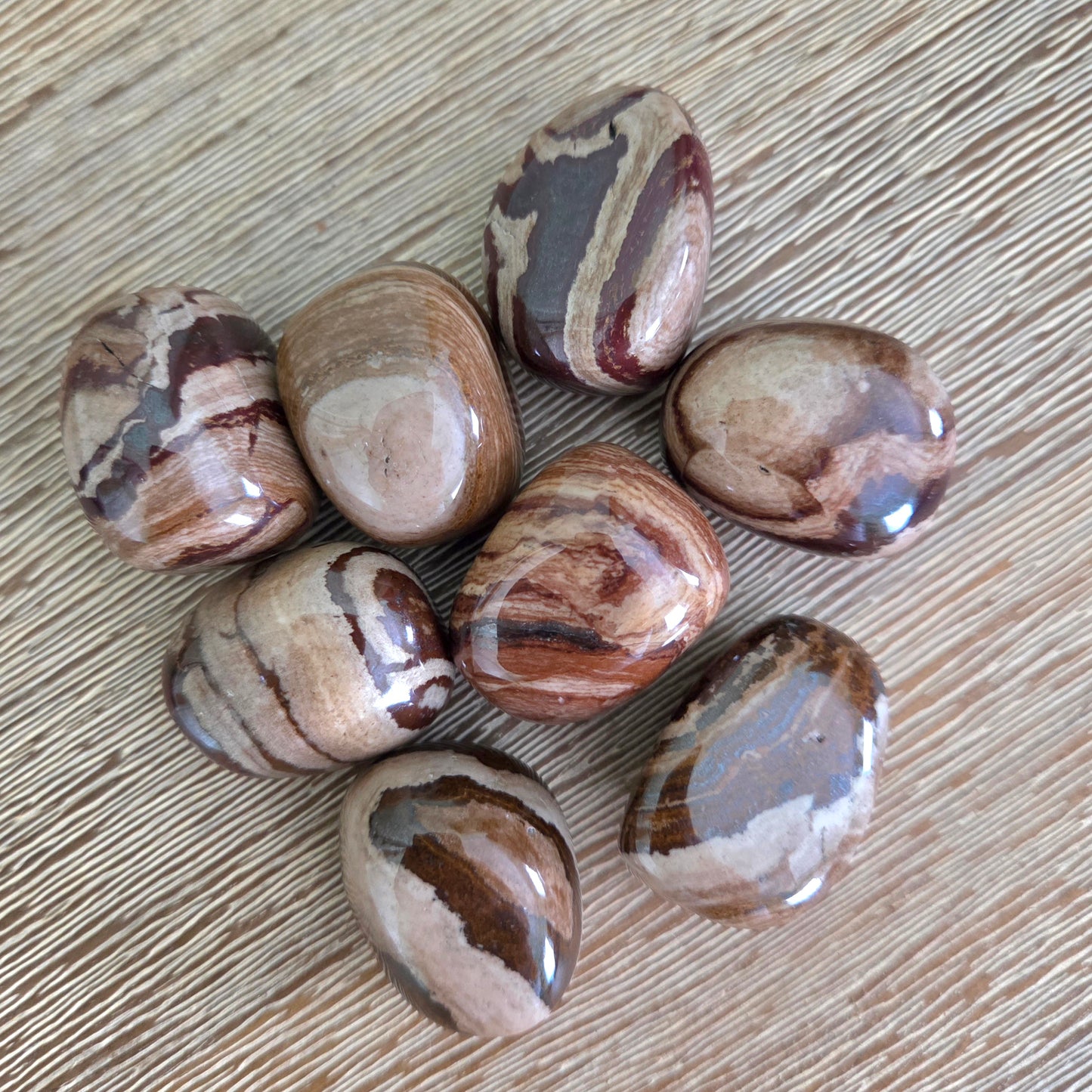 Marbled stones on a wooden surface