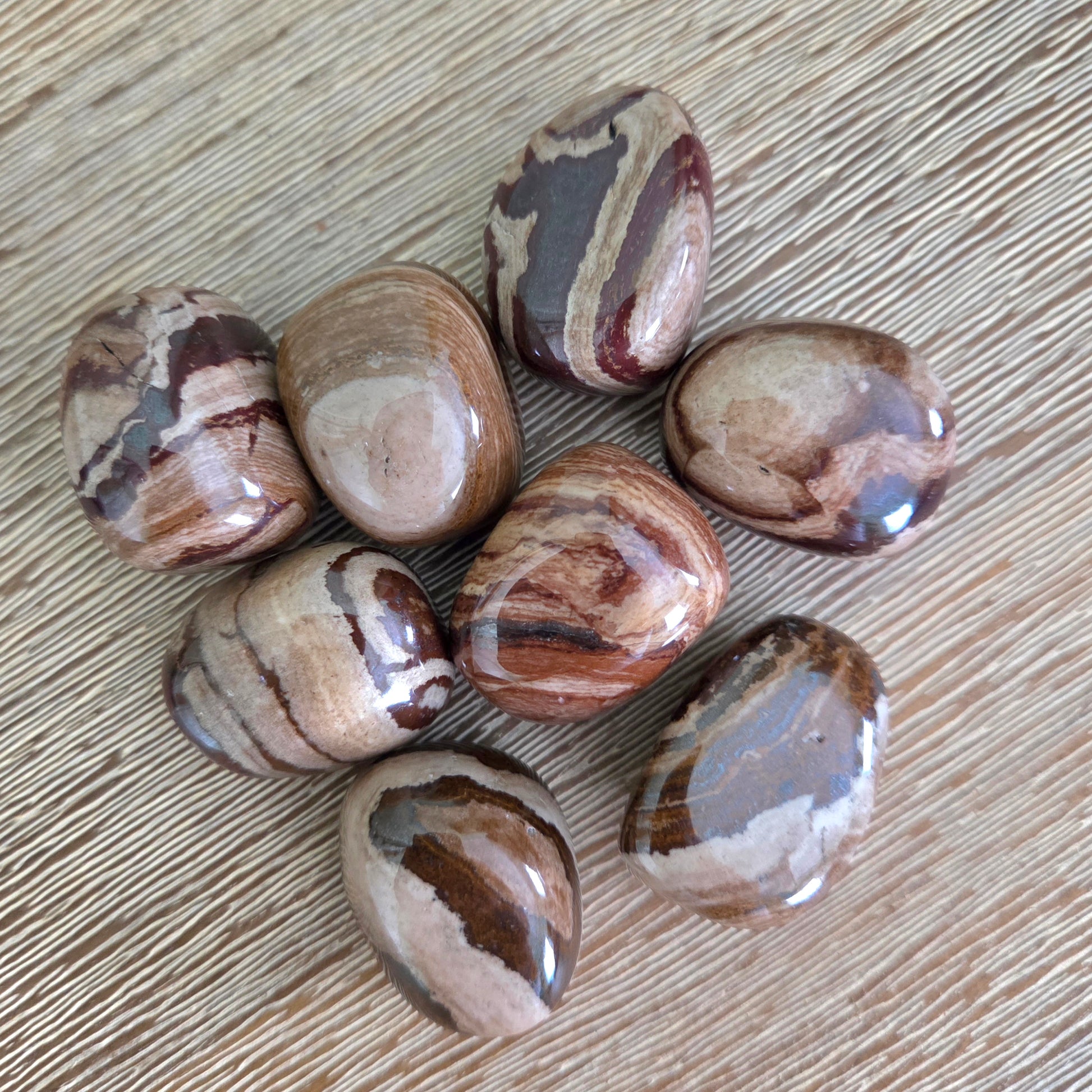Marbled stones on a wooden surface