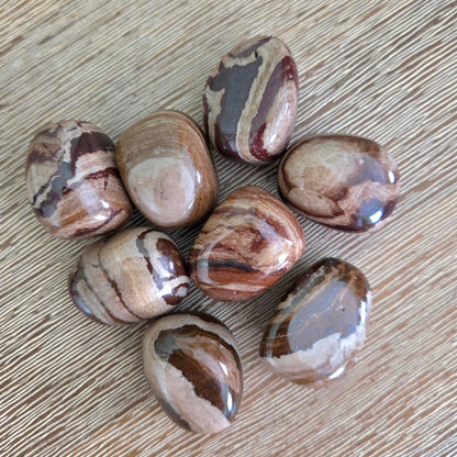 Marbled stones on a wooden surface