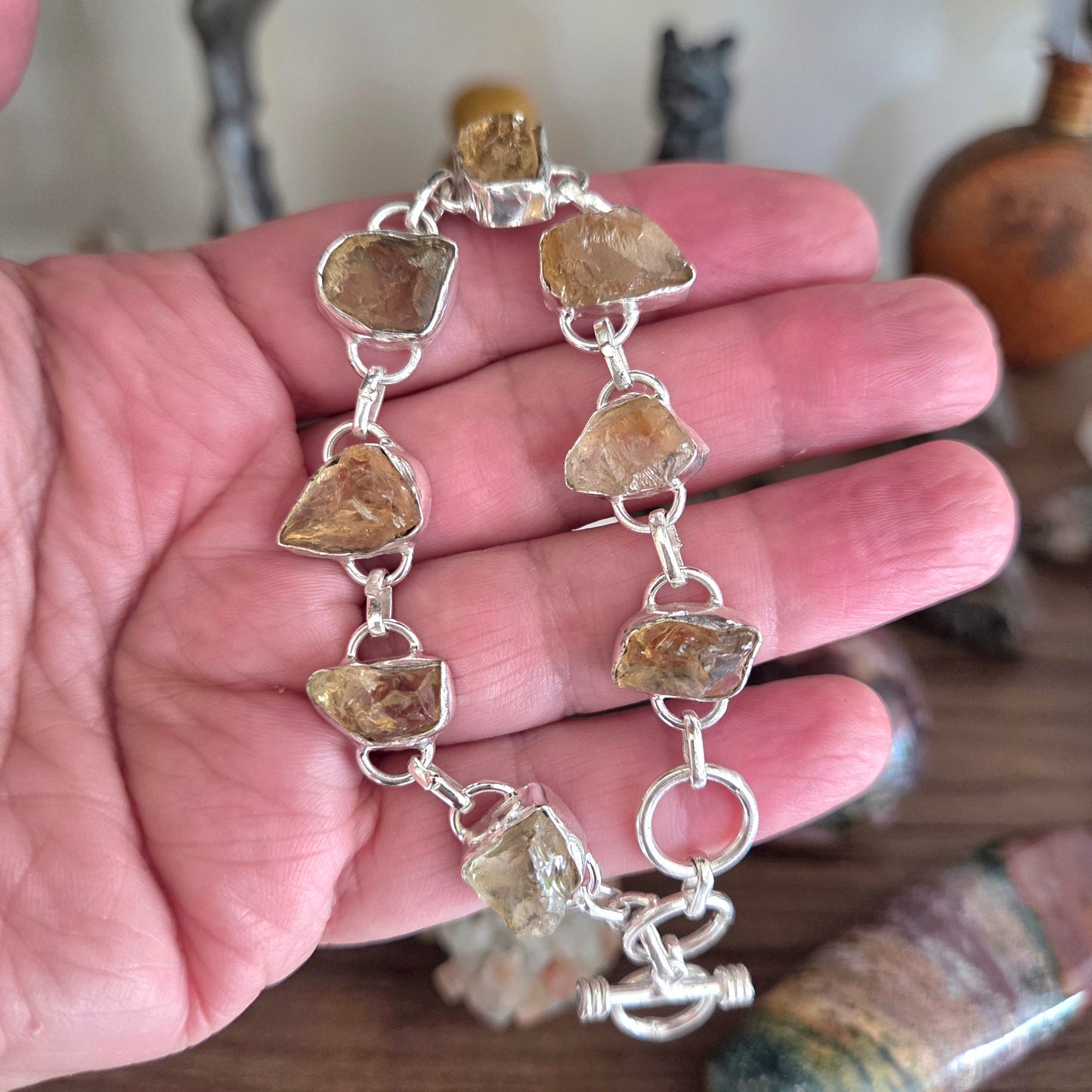 Bracelet with natural stone beads held in a hand