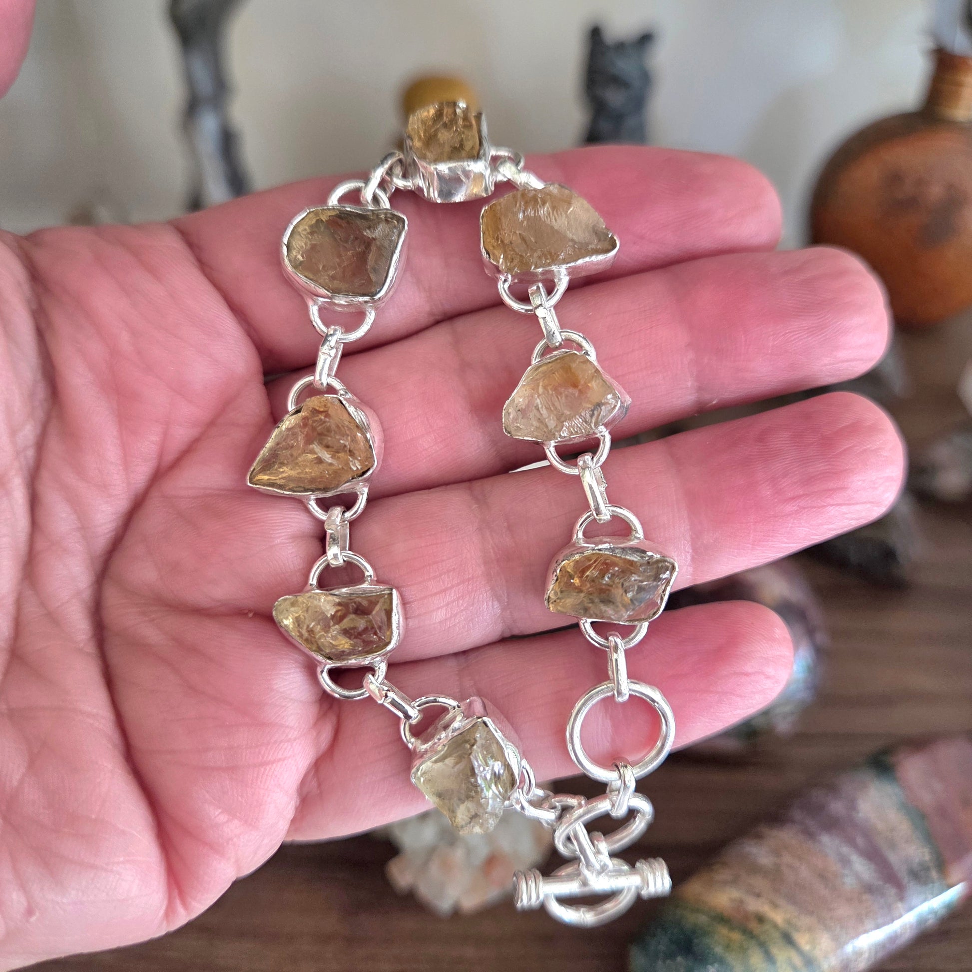 Bracelet with natural stone beads held in a hand