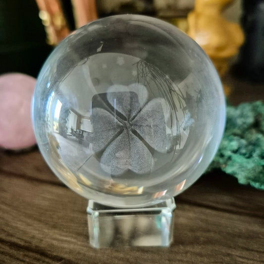 glass sphere with four leaf clover on lamp base