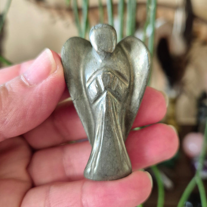 crystal angel held in a hand