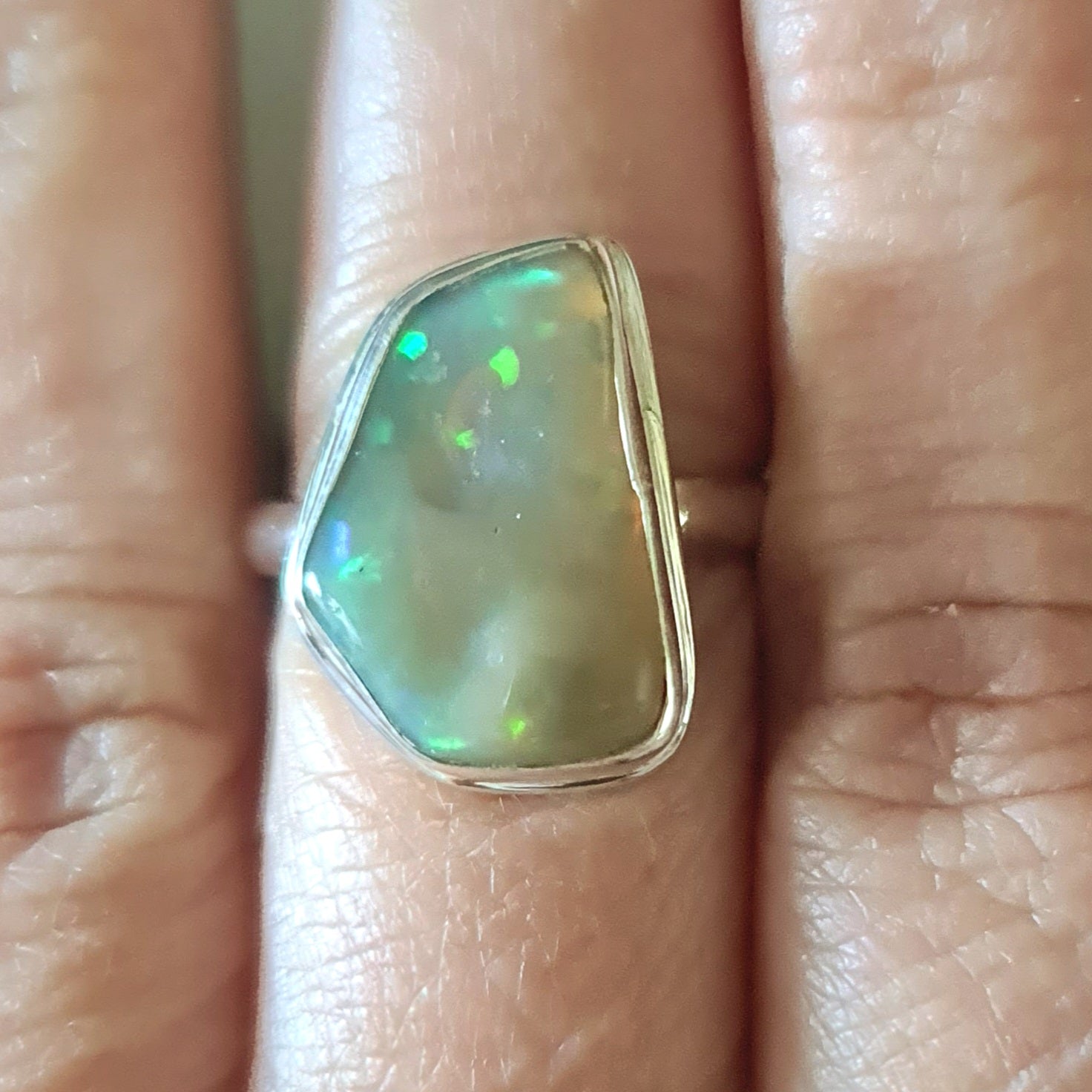 opal set in sterling silver on hand