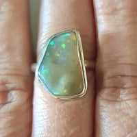 opal set in sterling silver on hand