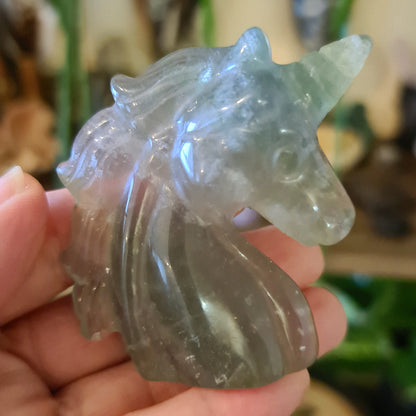 crystal shaped unicorn in a hand