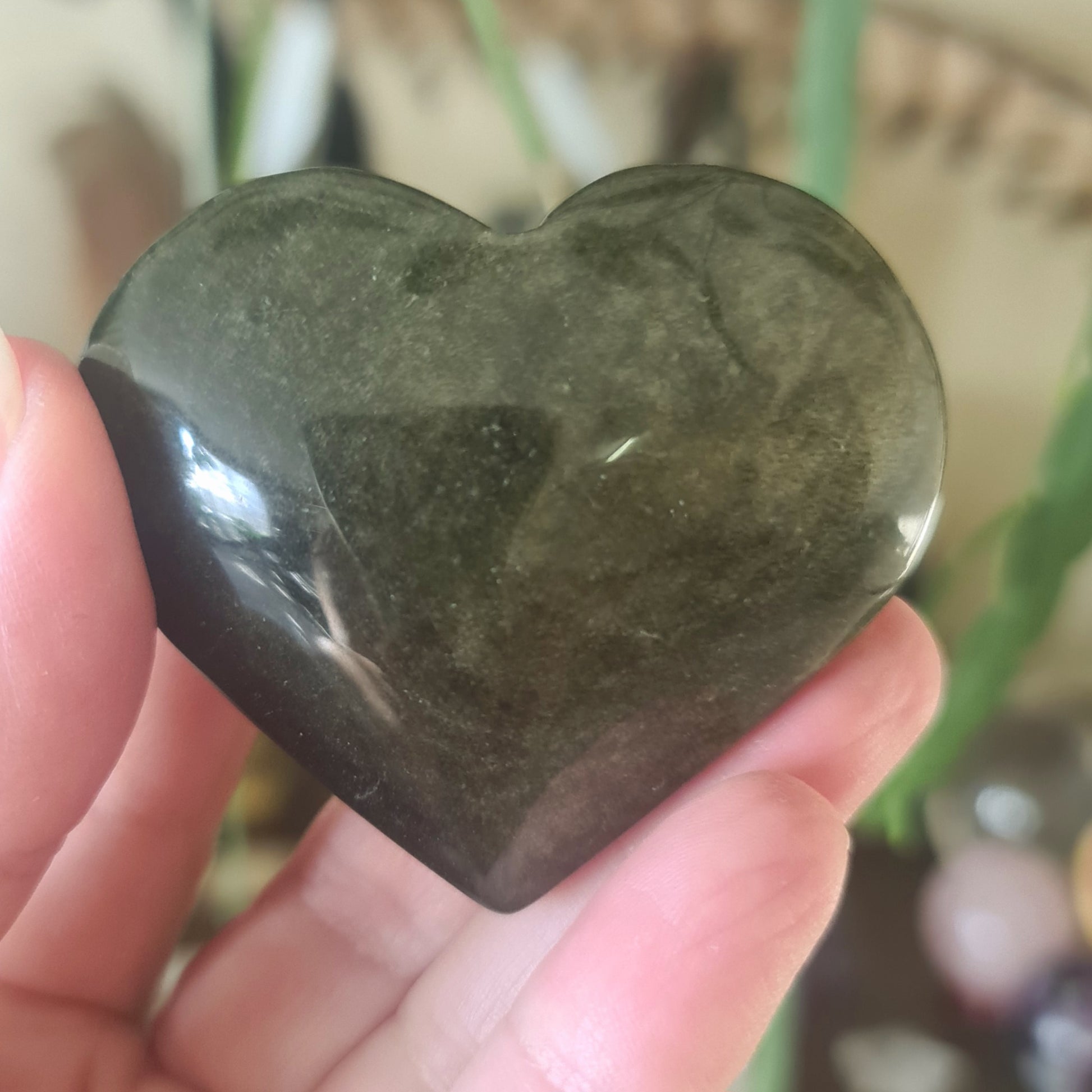 gold sheen heart held in hand