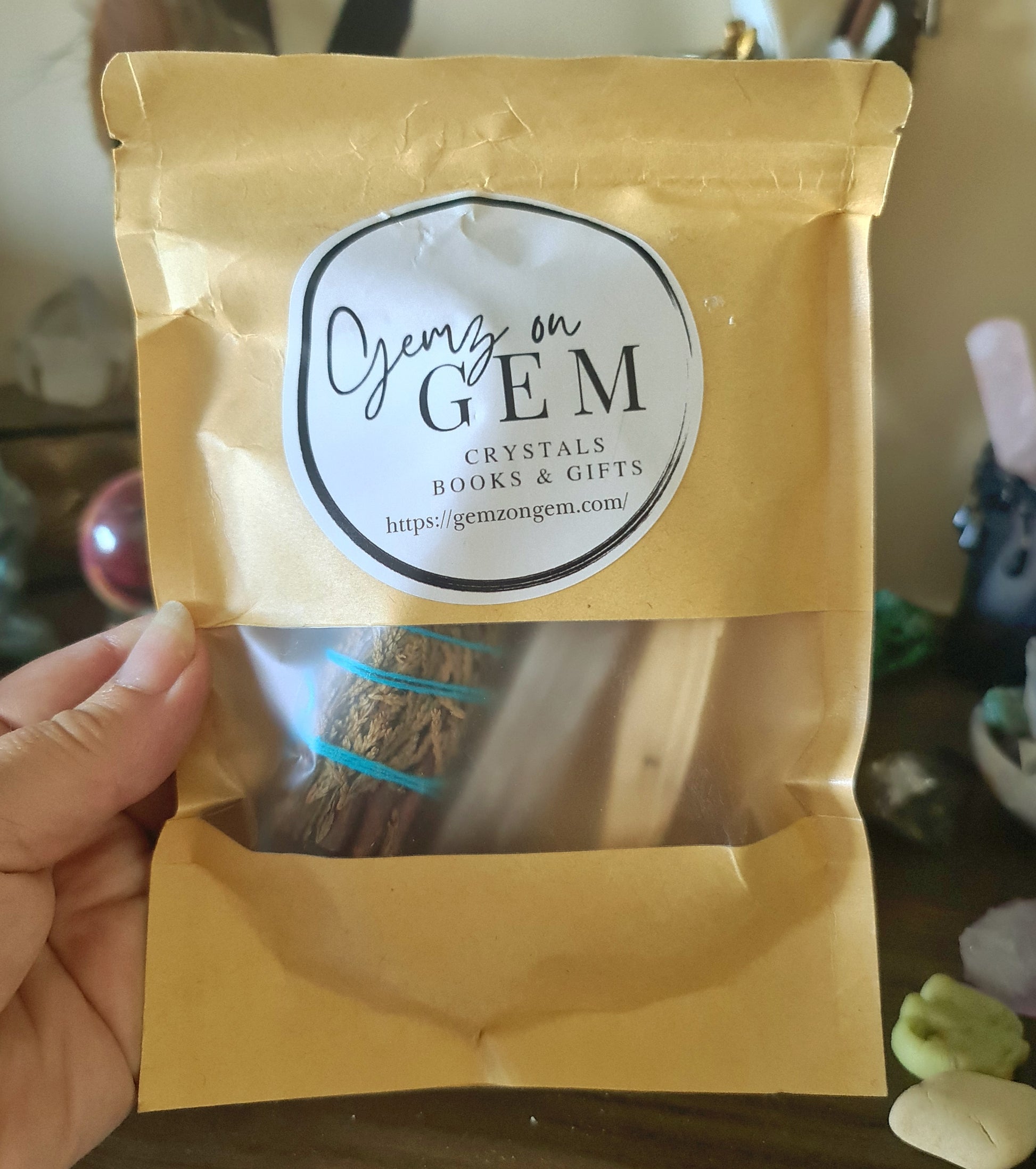 A packaged set of incense with a label that reads 'Onyx on Gem' and includes images of black obsidian, white sage, palo santo, and selenite sticks.