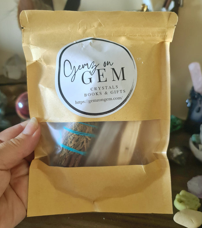 A packaged set of incense with a label that reads 'Onyx on Gem' and includes images of black obsidian, white sage, palo santo, and selenite sticks.