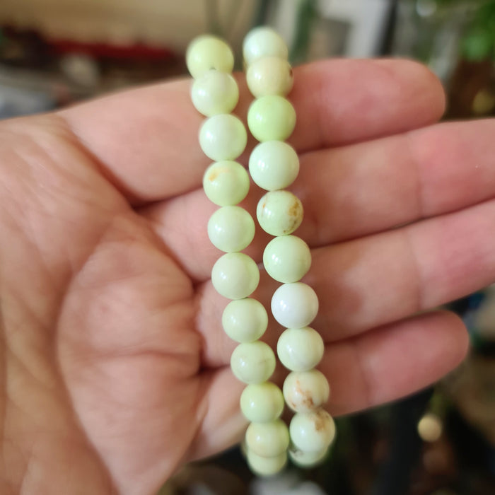 lemon beaded crystal bracelet held by a hand