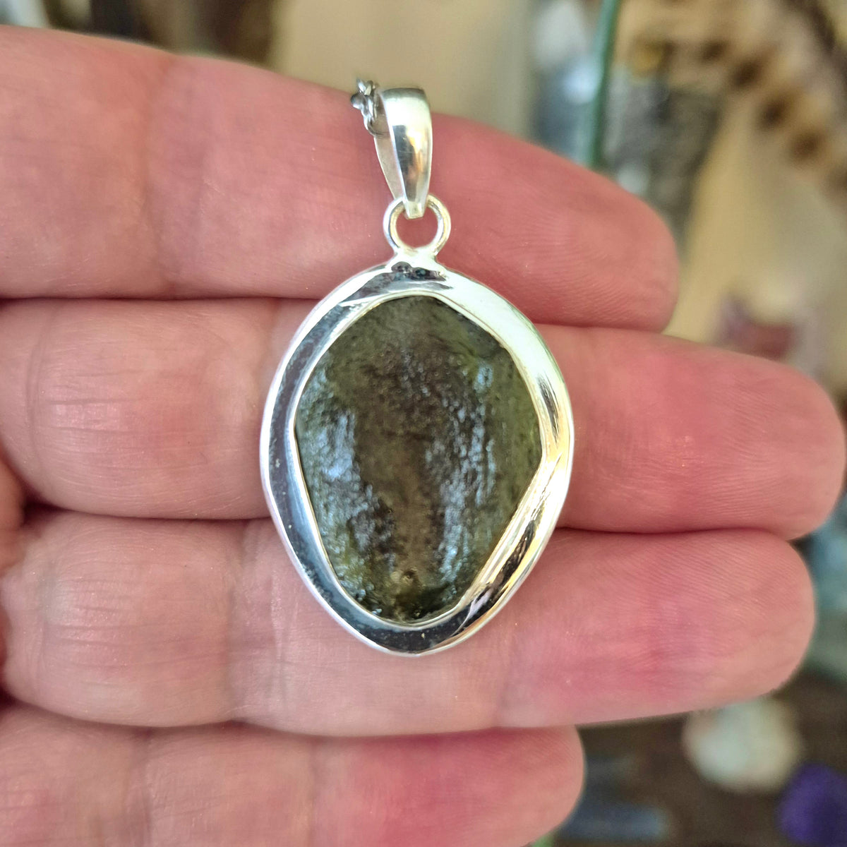Large moldavite in a pendant set in sterling silver