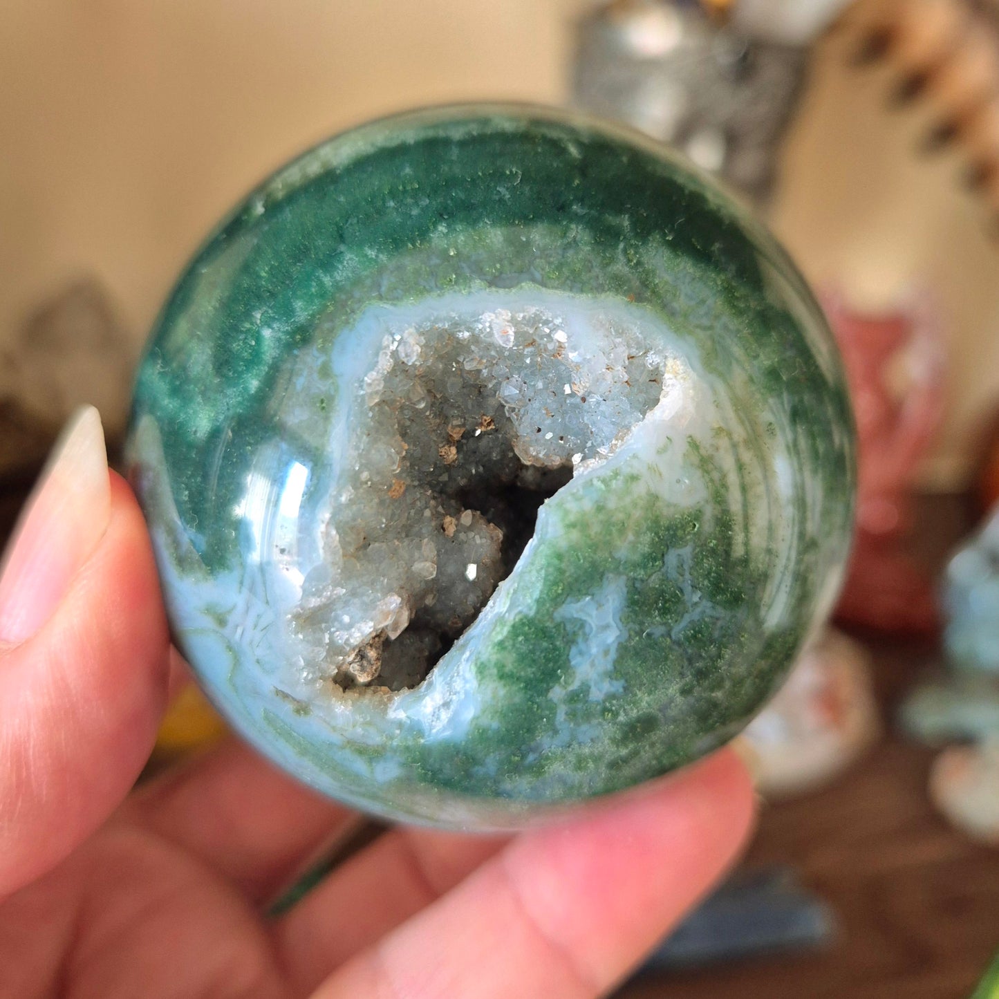 green crystal ball with druzy cave