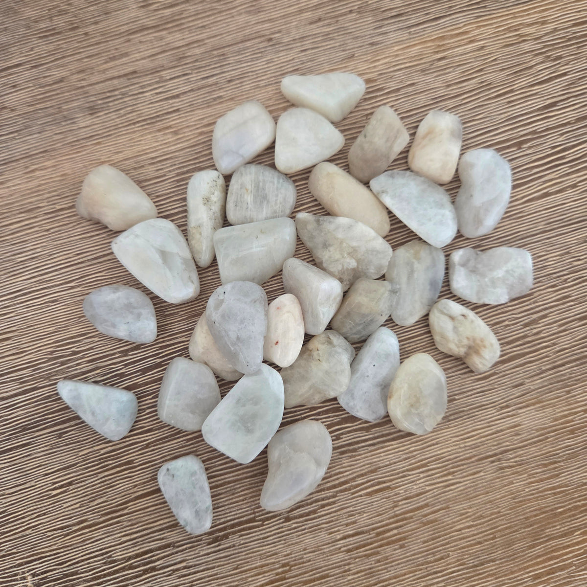 Small stones on a wooden surface