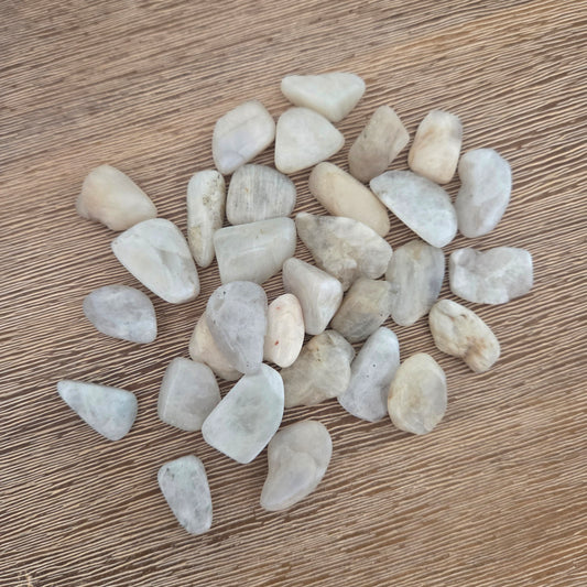 Small stones on a wooden surface