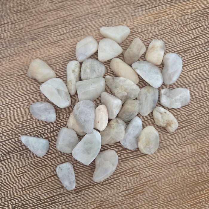 Small stones on a wooden surface