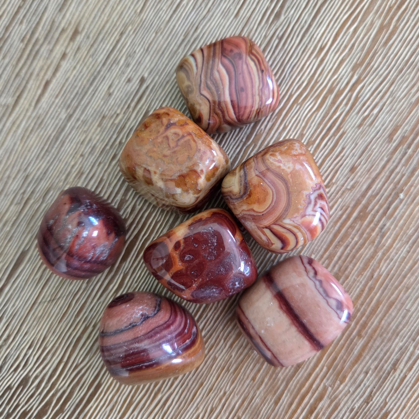 Marbled stones on a wooden surface
