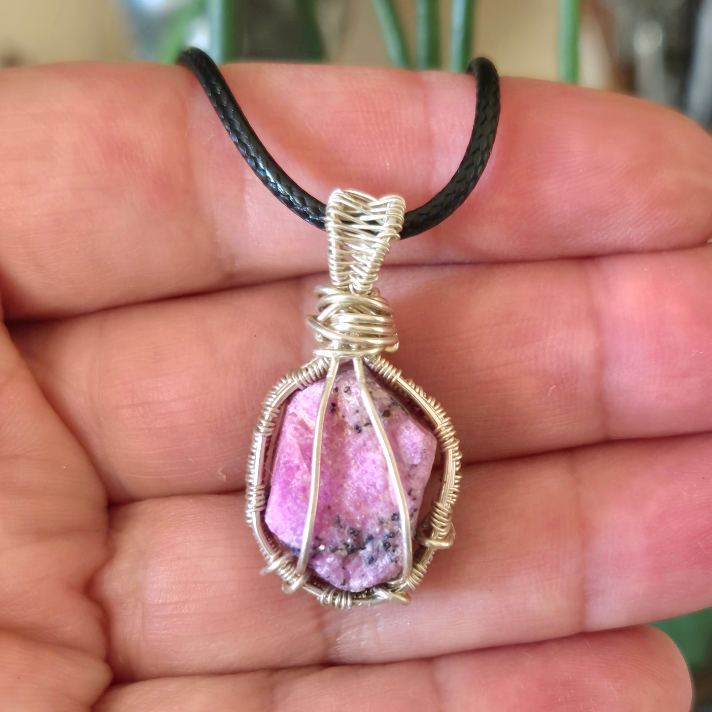 ruby crystal wrapped in silver wire