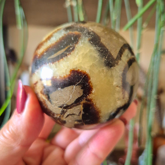 Septarian Sphere a yellow and brown crystal