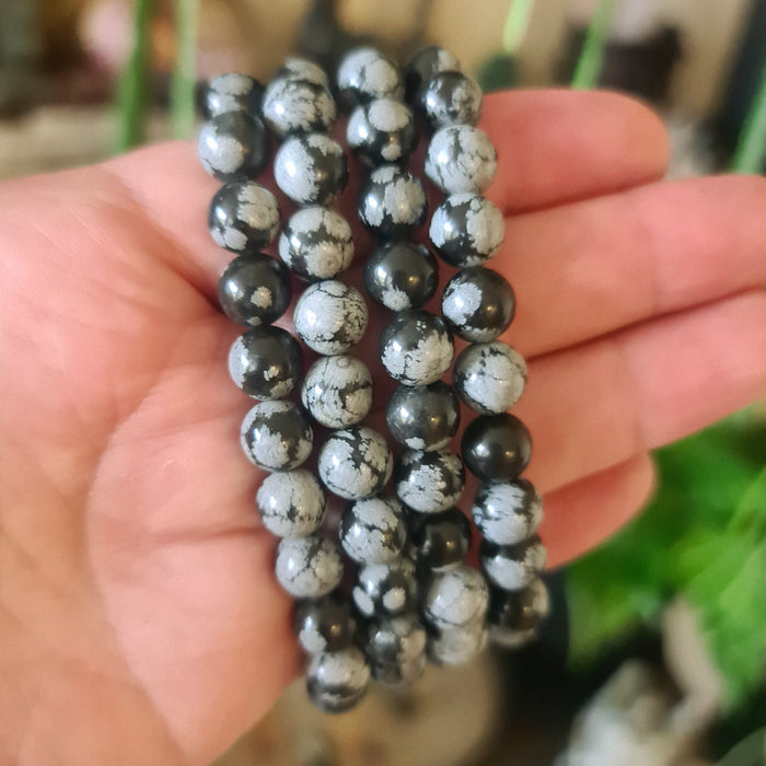 black and white beaded bracelet on a hand