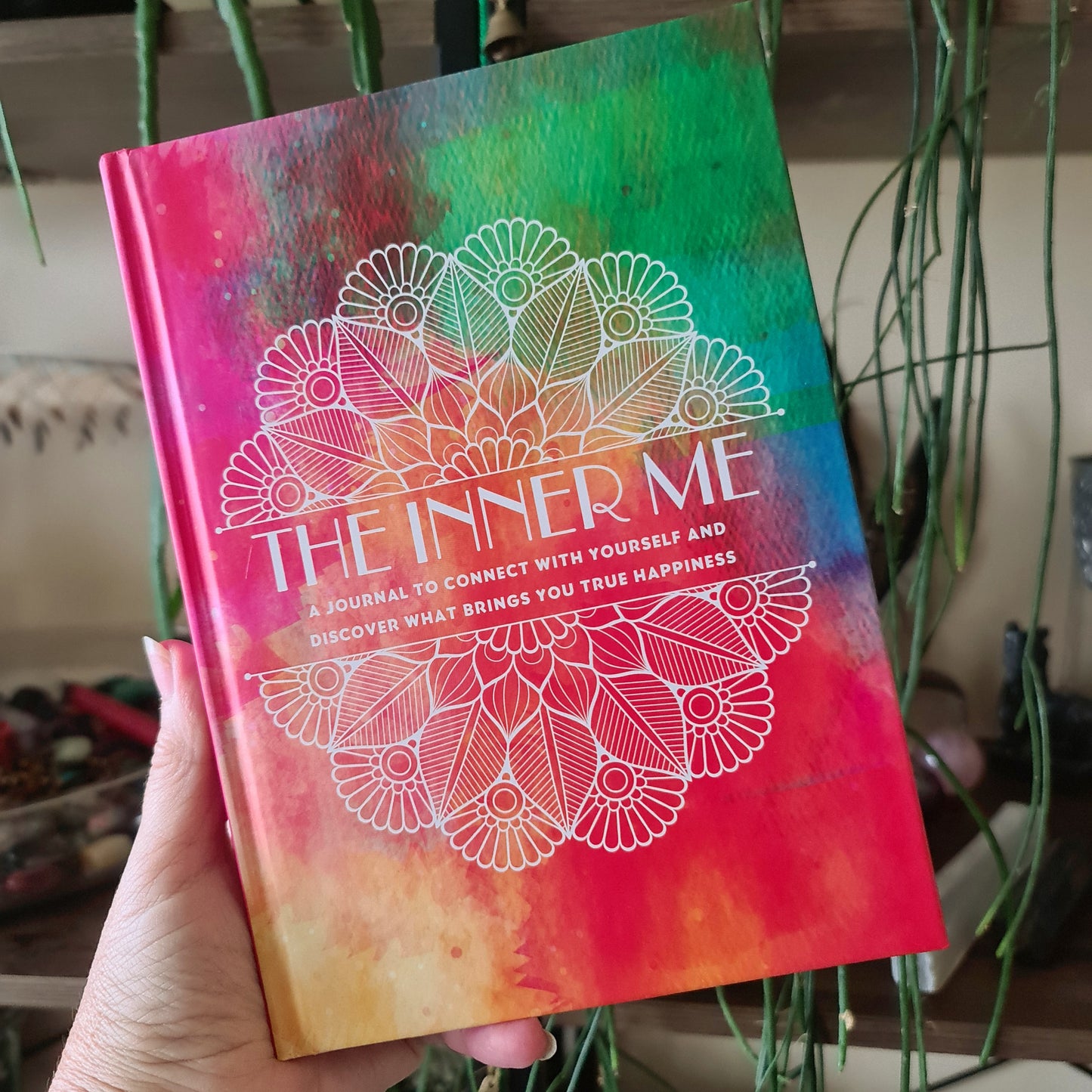 colourful book The Inner Me held by a hand